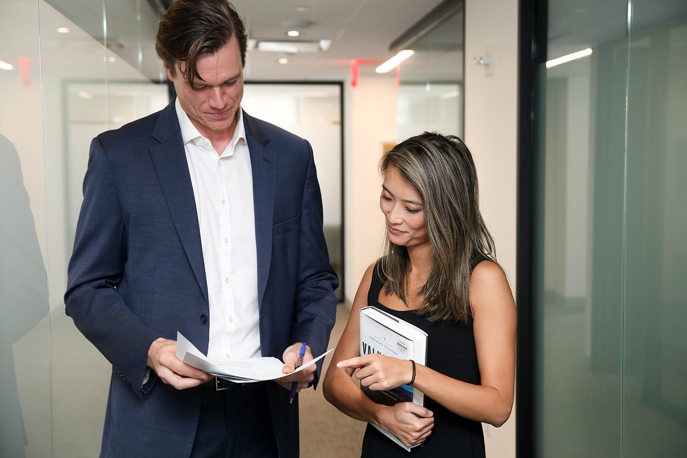 Two DWA employees looking at papers